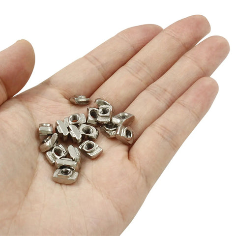 Hand holding Hammer Head T Nuts Set 100 Pieces 2020 Series Carbon Steel M4 T Slot Nuts Aluminum Profile Fastener Assortment Nickel Plated