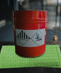 Chemical Spill Absorbent Pads 100 Count 17.5 By 13.5 Inches Heavy Duty Acid And Base Resistant with red hazardous drum