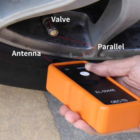Professional TPMS Relearn Tool For Tire Pressure Monitor Activation And Universal Sensor Reset Straight Shooter Diagnostics in hand near valve.