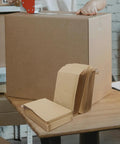 Khaki Kraft Bubble Mailers Set 22x34cm Drop Resistant Padded Envelopes on table with large shipping box