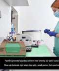 Chemical Spill Absorbent Pads 100 Count 17.5 By 13.5 Inches Heavy Duty Acid And Base Resistant displayed in lab setting.