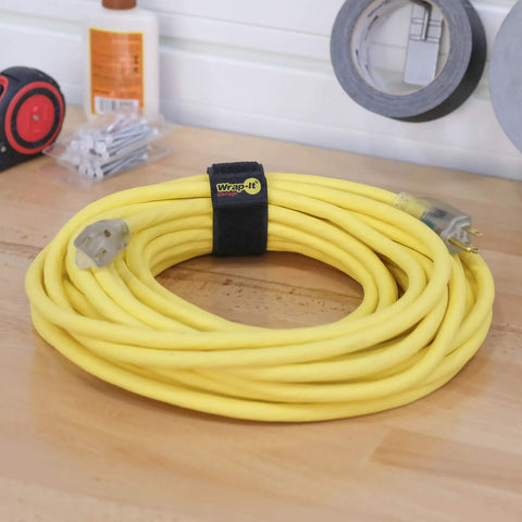 Selfie Straps 12 Inch 8 Pack Black Super Handy Stretchy Hook and Loop Cord Organizer securing a yellow extension cord
