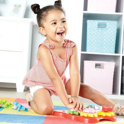Child playing with Toddler Sensory Gear Board Toy Set for Preschool STEM Fun Build and Spin Kid Friendly Barnyard Animals.