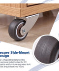 Close-up of Two Inch Low Profile Door Support Wheels, Anti Sag Caster Rollers For Solid Wood Doors And Gates, Heavy Duty Grey hardware mounted on wood.