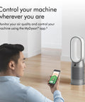 Person using smartphone with Hot And Cool HP07 Air Purifier With Heater And Fan, All In One Climate Control visible in room