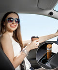 Woman in sunglasses holding coffee in car featuring Tesla Model Y Juniper Standard Center Console Organizer Set.