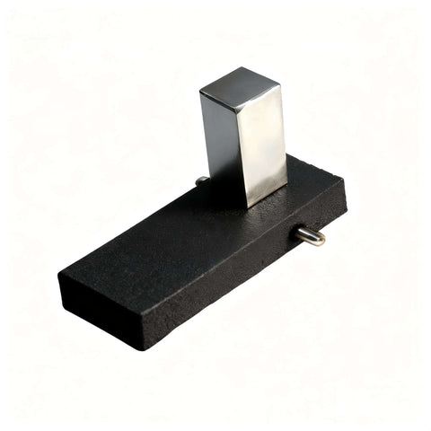 Magnetic hold-down clamp with silver rectangular magnet on black base; for laser engraving on honeycomb work tables.