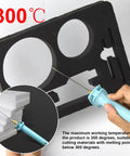 Hand using 30W Foam Cutter Pen Kit with 12V Power Adapter on black foam sheet, showcasing 10cm hot wire for precise styrofoam shapes.