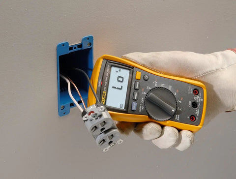 Hand using Digital Multimeter With Non Contact Voltage Detection VoltAlert Technology AutoVolt Automatic AC And DC Voltage Selection