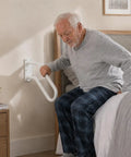 Heavy Duty Iron Wall Mount Stair Hand Rail With A Hella Strong Non Slip Grip For Outdoor Steps Or Bathroom Porch Classic White Finish No Fuss Setup Grab On Tight One Pack used by an older man to assist with standing up from bed.