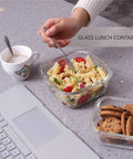 18 Piece Glass Food Storage Set With Lids BPA Free And Leak Proof Nesting Glass Meal Prep Containers next to food, cup, and laptop