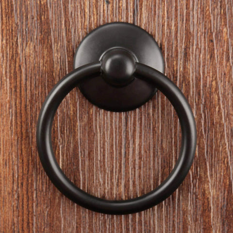 Front view of two pack black iron cabinet ring pulls with screws in a single hole design for kitchen cabinets, 1.73 inch ring diameter.