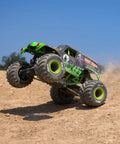 Grave Digger 1 To 18 Scale Mini LMT 4X4 RC Monster Truck RTR with green body and LED headlights riding on dirt track