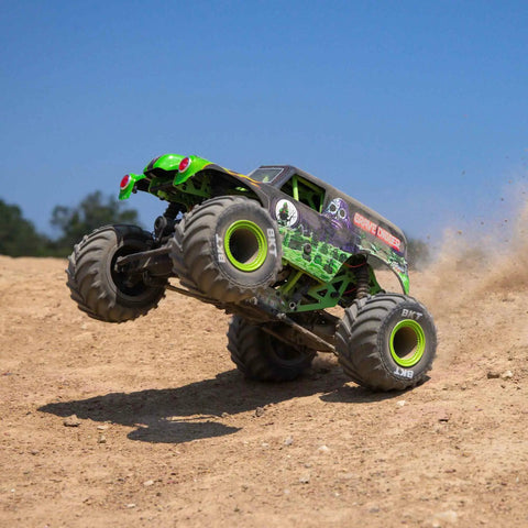 Grave Digger 1 To 18 Scale Mini LMT 4X4 RC Monster Truck RTR with green body and LED headlights riding on dirt track