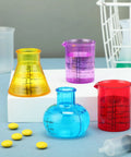 Colorful mini flasks and beakers from Eight Piece Science Measuring Flask Set For Kids Including Colorful 30ml Graduated Cylinders.