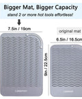 Comparison of two silicone mats; larger mat is 11x7.5 inch, smaller is 9x6.5 inch; Heavy Duty Heat Resistant Mat For Curling Irons And Hair Styling Tools 11 Inch By 7.5 Inch Silicone Counter Pad That Keeps Your Counter Safe From Heat And Lets You Wrap Or Park Hot Tools Like A Pro During Styling visible