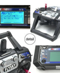 Close-up of Six Channel 2.4GHz RC Transmitter With FS-iA6 Receiver For Helicopters, Planes, Quads, Glide Mode 2 Ready, Interference Free AFHDS 2A Signal, Long Range Control, User Friendly Hobbyist Radio System showing display and controls.