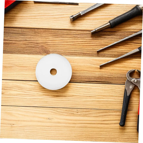 Heavy Hitter Nylon Pulley Wheels With Precision Ball Bearings Smooth Gliding Caster Rollers on a wood surface with tools.