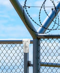 Six Pack End Rail T Clamps For 1-3/8 Inch OD Pipe Heavy Duty Galvanized Steel Fence Connectors with bolts installed on fence