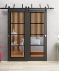 Clear Glass Sliding Barn Closet Doors With Matte Black Hardware, 84 by 96 Inches, modern interior view shown