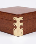 Close-up of golden retro metal corner protector on wooden case, part of Retro Metal Corner Protectors 20 Pack For Boxes And Wooden Cases Old School Charm Edge Guards Resistant To Daily Wear Easy To Install Decorative Corner Trim For Frames Albums Cabinets And Home Improvement.