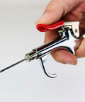 Close-up of blow gun with nozzle from Deluxe One Quarter Inch Air Compressor Accessory Kit with Twenty Five Foot Recoil Hose and accessories.