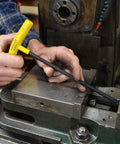 Set Of 10 Balldriver And Hex T-Handles For 3/32 To 3/8 Inch Fastener Sizes, being used by a mechanic for maintenance work