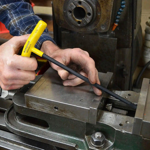 Set Of 10 Balldriver And Hex T-Handles For 3/32 To 3/8 Inch Fastener Sizes, being used by a mechanic for maintenance work
