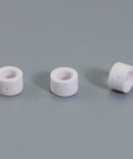 Three ceramic cups from Pro Grade Plasma Cutting Torch Consumables Kit For PT 31 LG 40 JG 40 Featuring Nickel Plated Tips Extended Nozzles