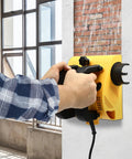 Hardcore Electric Wall Planer With Strong Motor designed for smooth concrete scraping, user grips planner on wall.