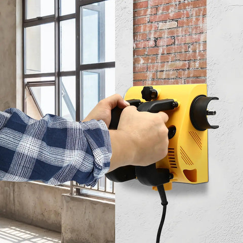 Hardcore Electric Wall Planer With Strong Motor designed for smooth concrete scraping, user grips planner on wall.