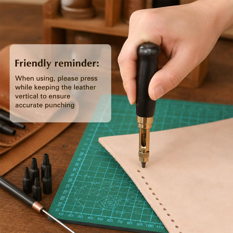 Slick Adjustable Leather Hole Punch With Solid Wood Handle Awl in use on leather, showing clear punctures with a brass mechanism.
