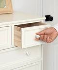 A hand pulling open a drawer featuring Hella Stylish White Marble Cabinet Knobs 10 Pack Dresser Hardware Modern Drawer Pulls.
