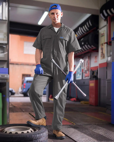 Men's Short Sleeve Coveralls Lightweight Breathable Mechanic Work Jumpsuit Summer Grind Threads worn by a mechanic in a garage.