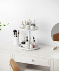 2 Tier Rotating Lazy Susan Spice Rack Organizer for Kitchen Counter Smooth 360 Spin White Storage Rotator with beauty products.