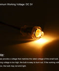 Hella Bright E10 Miniature Bulbs, DC 3V Warm Yellow Glow Screw Base Torch Lamps Indicator Lights, lit close-up of lighted bulb.