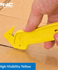 Heavy Duty Dual Head Concealed Safety Cutter Hits Different For Slicing Shrink Wrap Film Cardboard And Plastic Straps With Recessed Blades For Zero Slip Protection And No Sweat All Day Long, shown cutting cardboard.