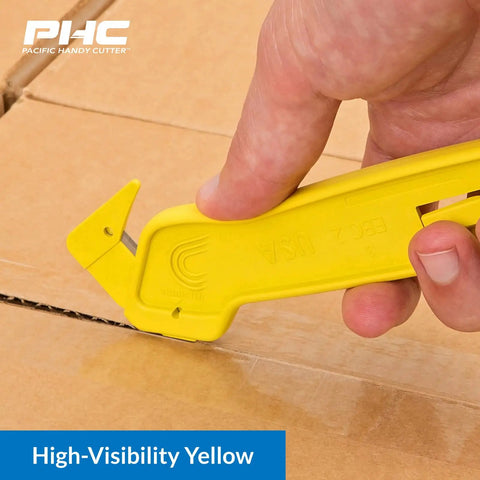 Heavy Duty Dual Head Concealed Safety Cutter Hits Different For Slicing Shrink Wrap Film Cardboard And Plastic Straps With Recessed Blades For Zero Slip Protection And No Sweat All Day Long, shown cutting cardboard.