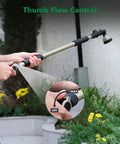 Using the Extra Long All Metal Telescoping Watering Wand With 180 Degree Adjustable Ratcheting Head and Four Spray Patterns, Thumb Flow Control in garden.