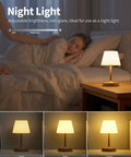 Cordless LED Wood-Grain Table Lamp With Waterproof Shower Design on a bedside table next to a sleeping child.