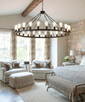 53 Inch Farmhouse Wagon Wheel Chandelier With 24 Lights Rustic Black Round Ceiling Light in bedroom setting
