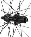 Close-up of Ultra Light 1390g Carbon Road Disc Wheelset hub with spokes, 12x142mm rear, 40mm depth Center Lock Clincher Tubeless Ready design.
