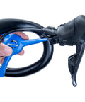 EWS-2 Bicycle Electronic Shift Tool For Shimano EW-SD3000 Wires And Batteries, shown on bike handle for wire installation.