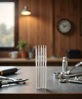 5 Pack Silver Steel Watch Stem Crown Kit For NH35 NH36 NH38 NH39 Movements Replacement Parts on a workbench.