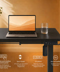 AdGiGi 40 Inch Electric Standing Desk Adjustable Height Sit Stand Workstation Compact Computer Table For Home Office Small Space Black showing control panel with laptop and glass.