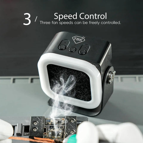 Mini Solder Fume Extractor with 3 Speed Settings extracting smoke from circuit board, features black body and activated carbon filter