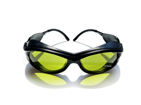 Heavy Duty Laser Safety Goggles Lock Down Eye Protection From UV IR And Blue Light Across 190 To 10600 Nanometers with green lenses and black frame.