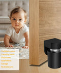 Magnetic Door Stopper And Holder For Secure Doors Under Two And A Half Inches Heavy Duty Stainless Steel Anti Rust Stops Slams And Keeps Doors From Slamming Steady And Reliable For Home And Office Black Finish 1 Pack shown installed on wooden door with child nearby.