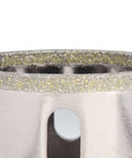 Close-up view of 3/4-inch diamond hole saw blade with yellow diamond segments on a metal housing