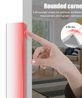 Close-up of a hand touching a rounded corner protector, showcasing its 2.5D design for safety. Heavy Duty Self Adhesive Wall Corner Protectors Featuring A Quick Peel And Stick Mount Plus Durable Pc Edge Guards That Handle Daily Chaos Without Flinching Alongside A Solid Home Upgrade For Pet Friendly Rooms And Kid Safe Spaces.